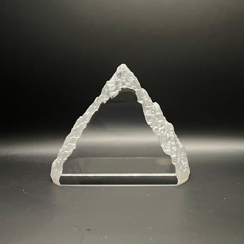 Triangular crystal mountain object on a black background