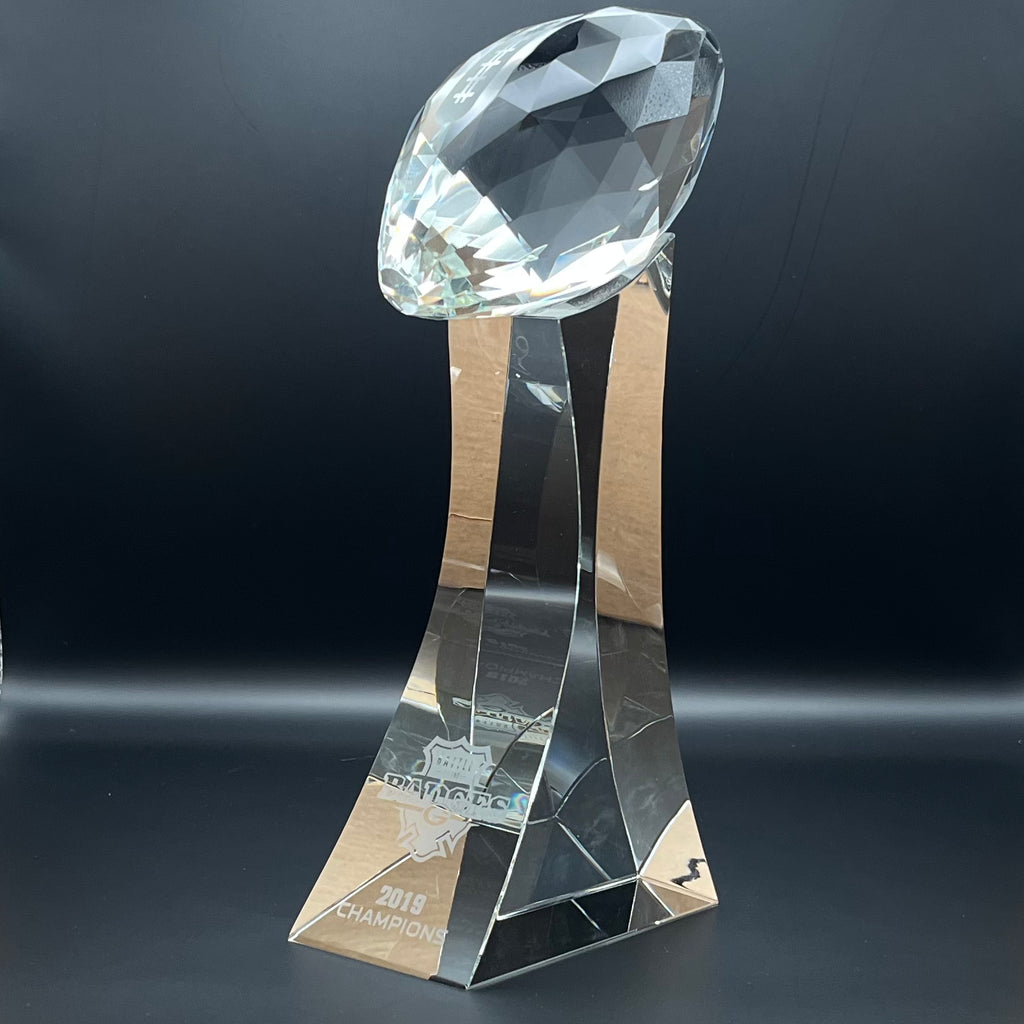 Crystal trophy with football on top 