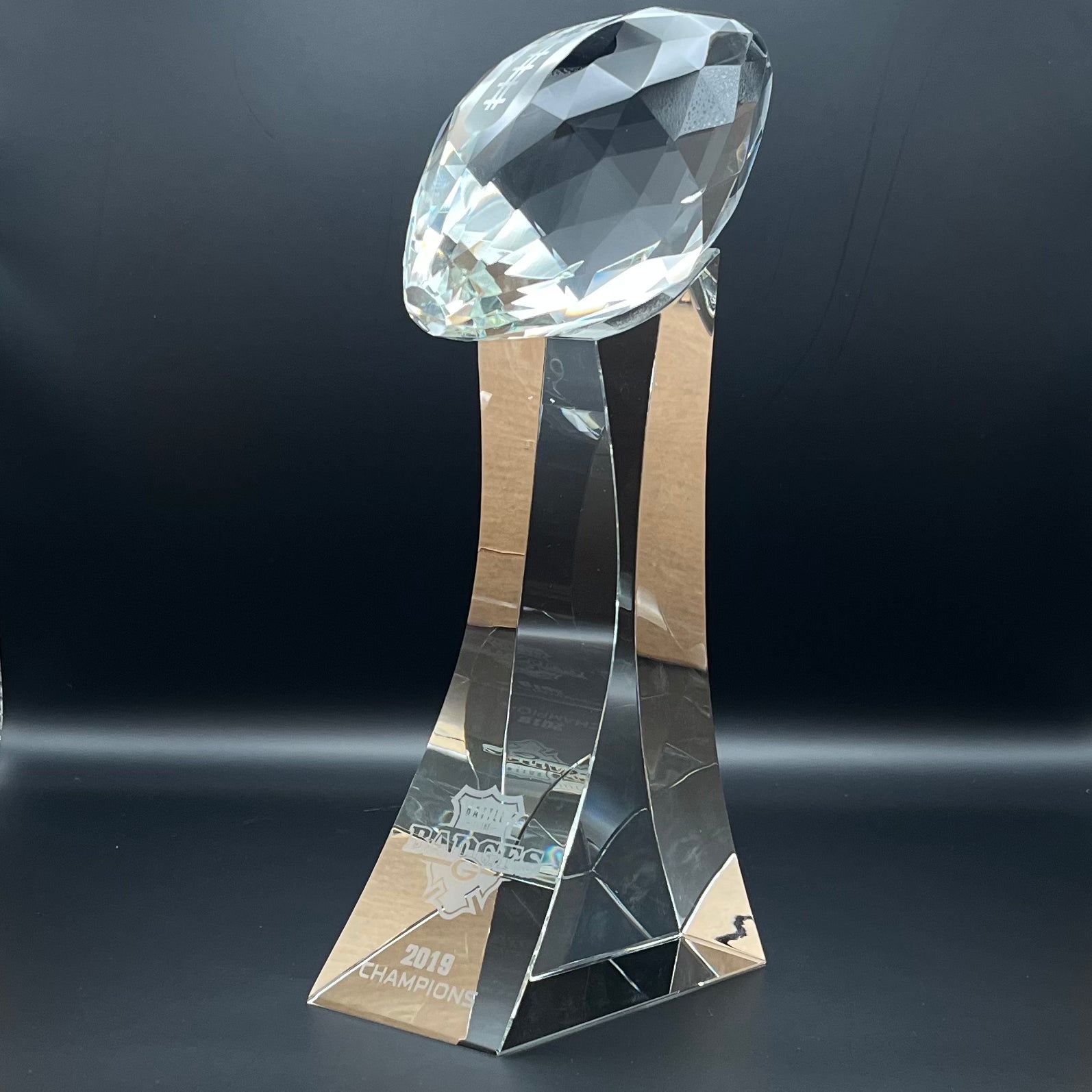 Crystal trophy with football on top 