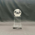 A clear crystal trophy stand featuring a soccer ball design on top of a rectangular base