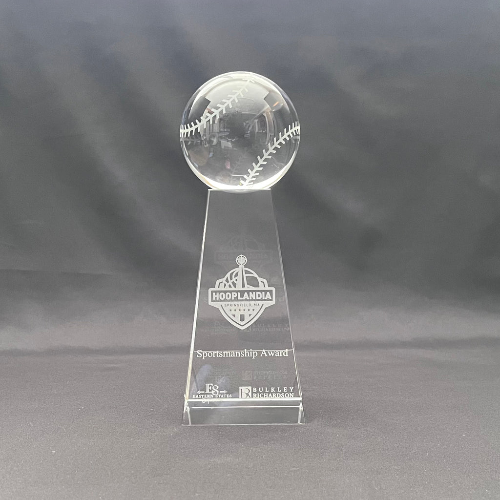 A clear crystal sportsmanship award trophy featuring a transparent baseball on a tapered base with engraved base 