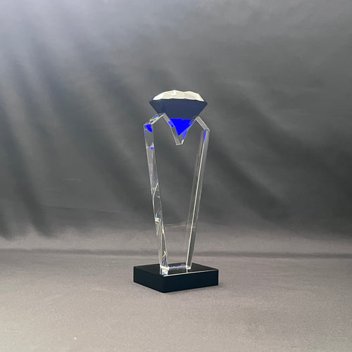 Blue crystal diamond on top of clear crystal base 