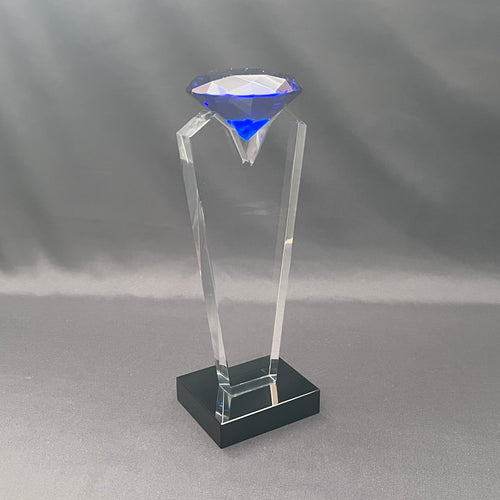 Side view of blue diamond on clear and black base 