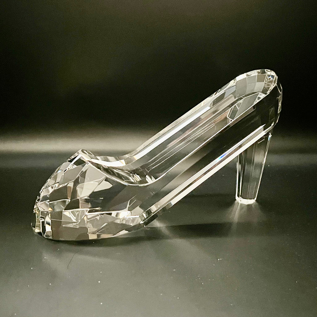 Crystal high-heeled shoe on a dark background