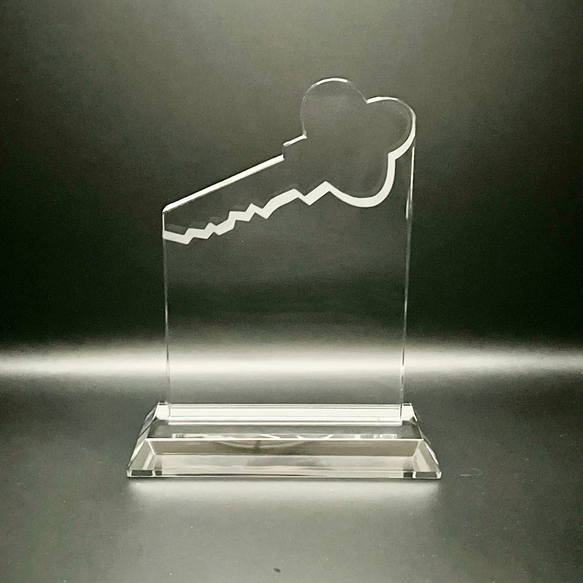 Clear crystal award with key design 