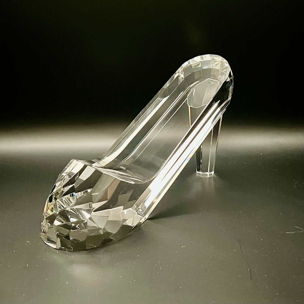 Crystal high-heeled shoe on a dark background