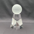A clear glass trophy featuring a frosted glass basketball on a faceted, geometric glass pedestal.
