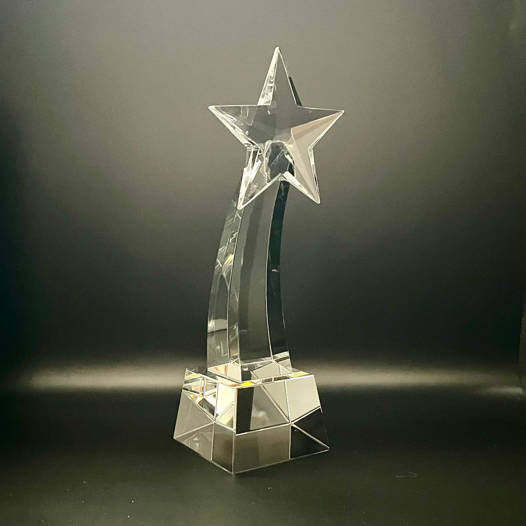 Crystal star-shaped trophy on a dark background