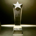 Crystal star-shaped trophy on a dark background