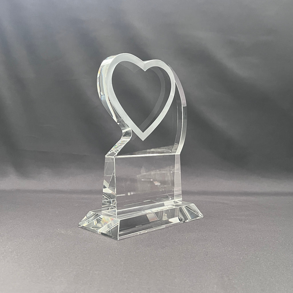 Side view of crystal heart on base 