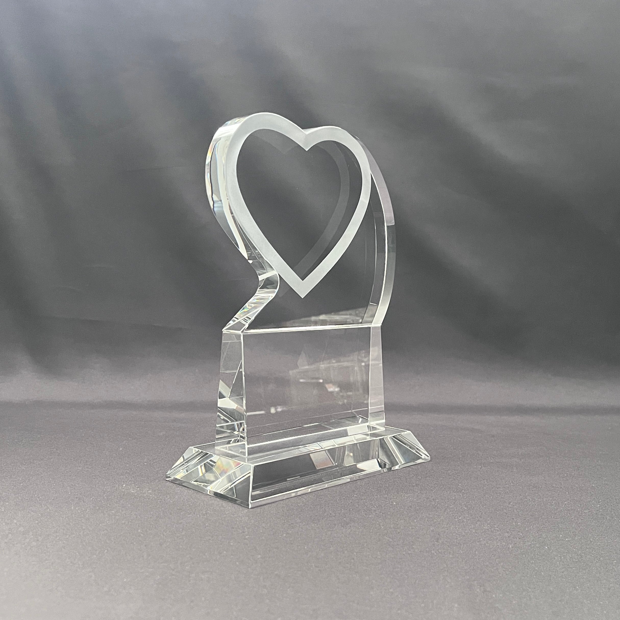 Side view of crystal heart on base 