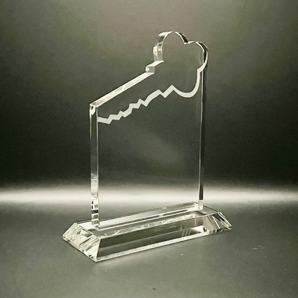 Clear glass key-shaped award on base