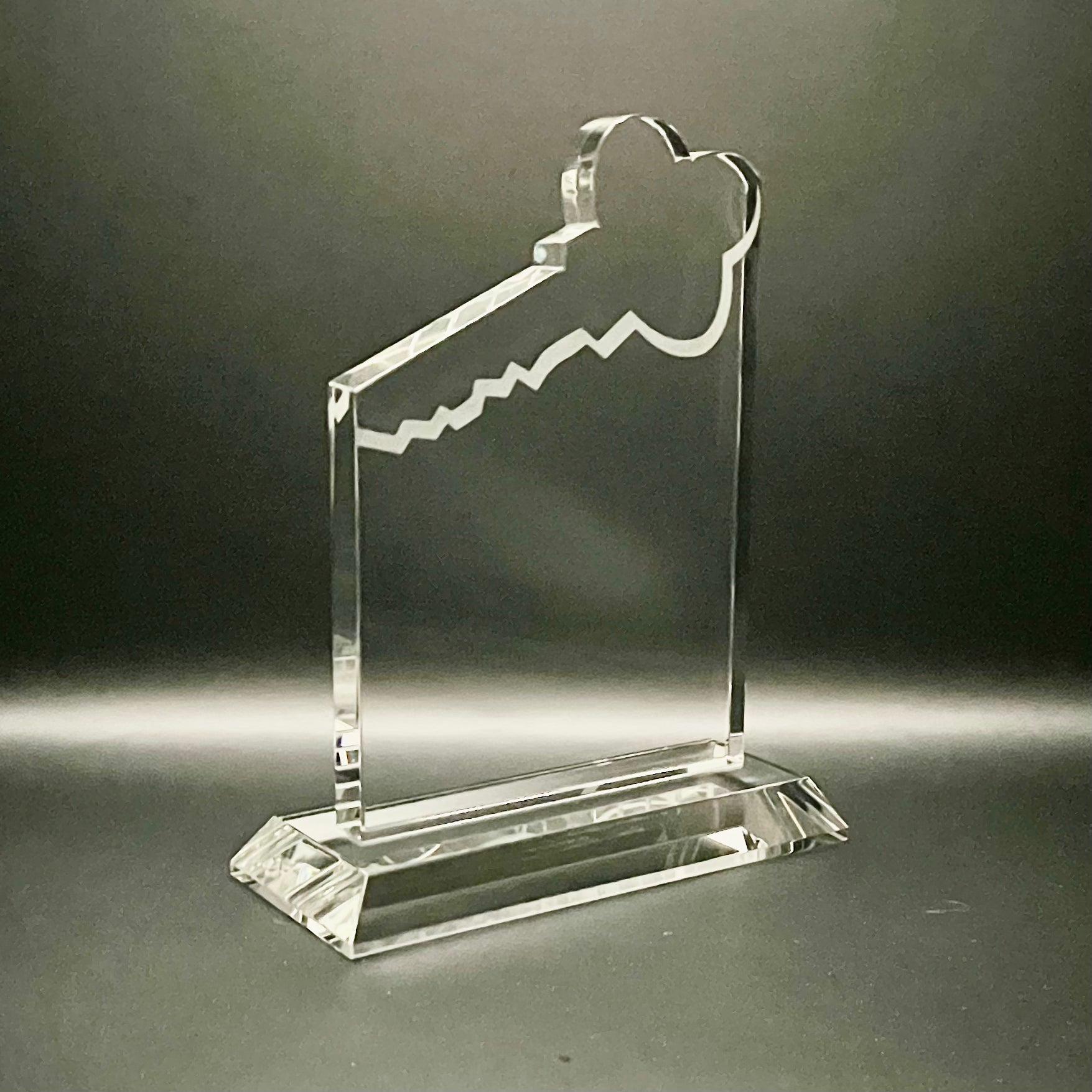 Clear glass key-shaped award on base
