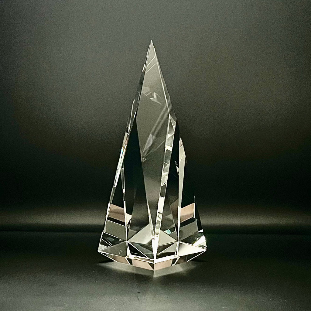 Crystal pyramid on a dark background