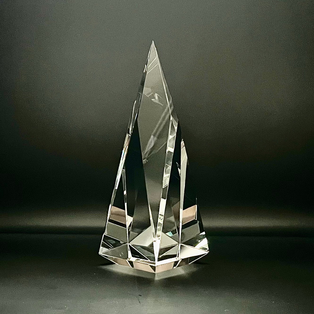 Crystal pyramid on a dark background